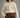 #color_ivory | Girl wearing a ivory white cotton gauze long sleeved blouse with brown pants