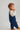 Toddler boy wearing GOTS-certified organic cotton corduroy overalls in navy blue from Cozmo - Peto de Pana Ancha para Bebé - Bebé 