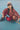 girl wearing gots organic cotton certified corduroy pants in red from cozmo in the school's playground - wide wale organic cotton corduroy jogger pants - Baby 