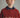 #color_ginger | Boy wearing a Cozmo wool sweater in red and beige hues