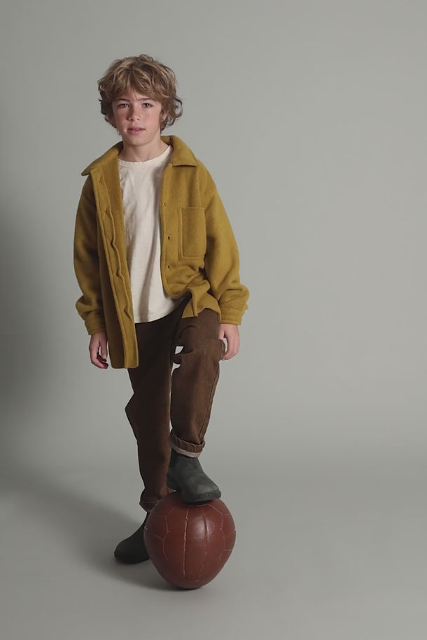 #color_brown | Boy wearing soft cotton denim jeans for boys rom Cozmo in a Winter outfit