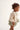 toddler girl in ivory crochet cardigan by cozmo