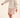 toddler girl in white and pink outfit by cozmo