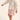 toddler girl in white and pink outfit by cozmo